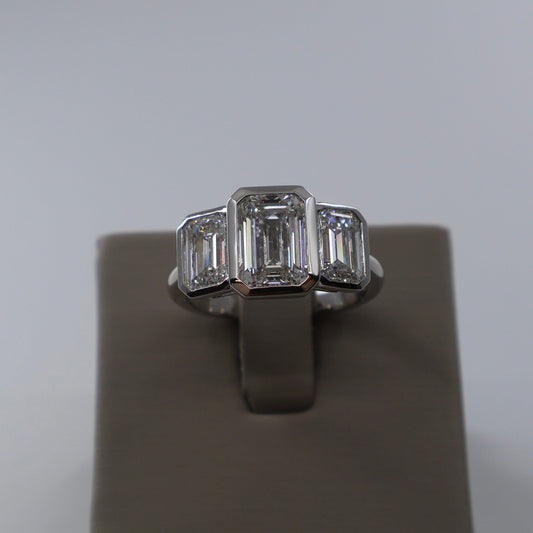 LAB GROWN 14KW 2.04 CT EMERALD CUT CENTER DIAMOND / 2.07 CTW EMERALD ON EACH SIDE BEZEL SET 2 STONE RING LABDRCD804