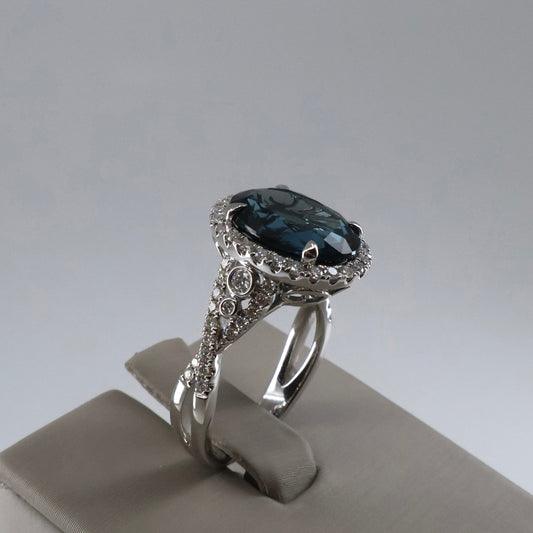 18KW .52CTW 62 ROUND DIAMOND HALO / 5.64CT OVAL LONDON BLUE TOPEZ RING DRCM4513