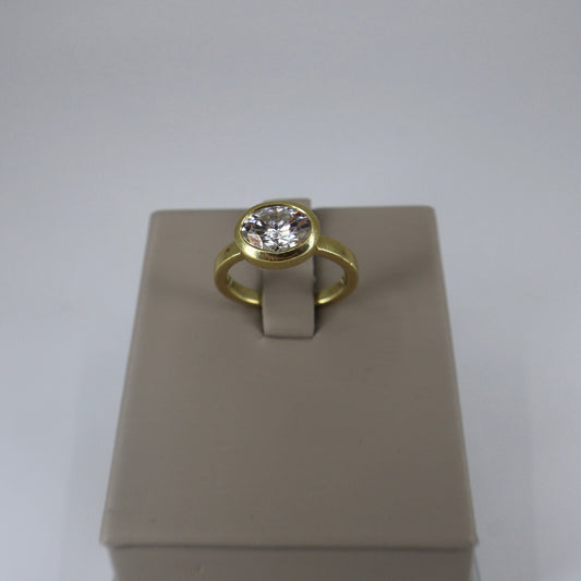 18K Yellow Gold 8x6 Oval Moissanite East-West Bezel-Set Ring OTC11458